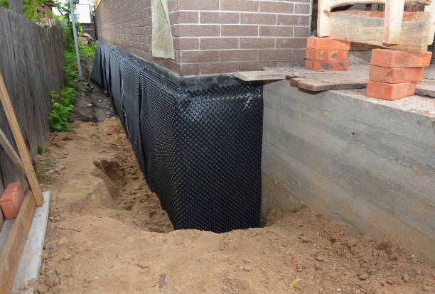 Happy homeowners after waterproofing job in Freedom
